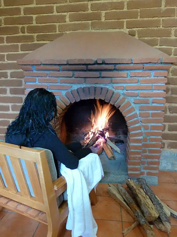 Hanging out by the fire in our eco cabin in the Pueblos Mancomunados in Mexico's Sierra Norte Mountains