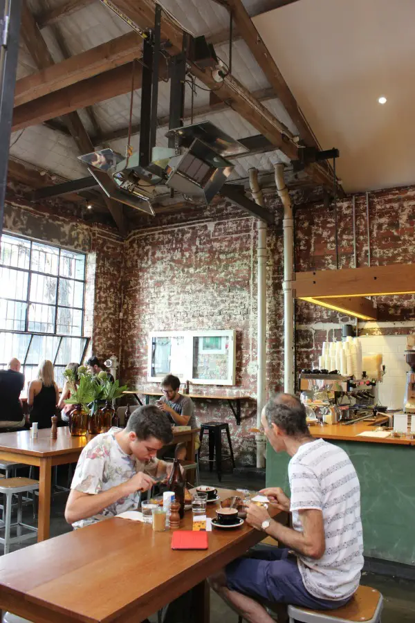 Drinking coffee at Seven Seeds in Carlton is part of the perfect one day in Melbourne Itinerary