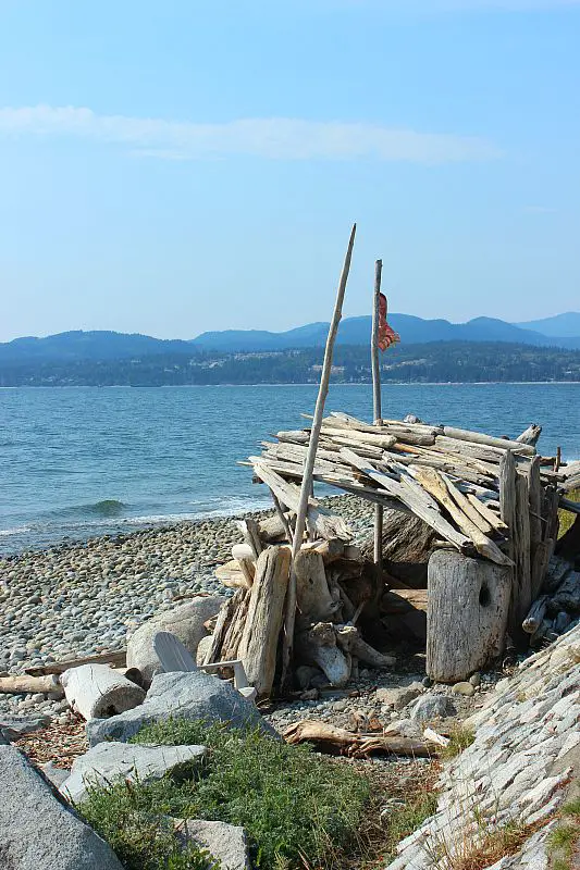 Finding a driftwood fort on Sechelt beach on Canada's Sunshine Coast during month two of digital nomad life