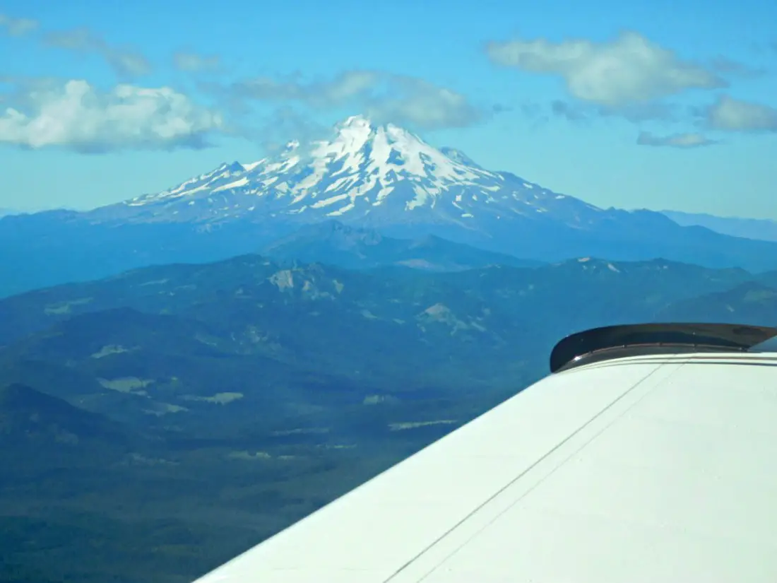 Flying in a tiny plane past Mount Shasta in Northern California during Month Twenty Eight of Digital Nomad Life