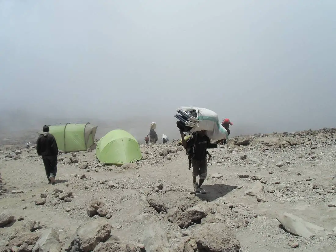 Porters will help you climb Kilimanjaro